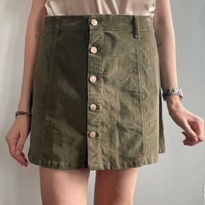 Green corduroy skirt. Buttons up front are real.